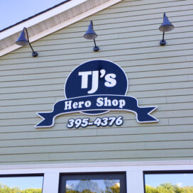 TJ's Hero Shop carved sign